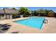Community pool with lounge chairs and well-maintained grounds, perfect for relaxation and recreation at 3928 Edgemoor Way, Las Vegas, NV 89121
