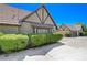 Tudor-style home exterior featuring landscaping and a two-car garage at 3928 Edgemoor Way, Las Vegas, NV 89121