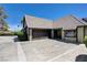 Home with a two-car garage and front entrance with parking in the driveway at 3928 Edgemoor Way, Las Vegas, NV 89121