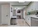 Modern kitchen with white cabinetry, stainless steel appliances, and tile backsplash at 3928 Edgemoor Way, Las Vegas, NV 89121