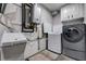 Laundry room with modern appliances, a utility sink, and storage cabinets, creating a convenient and functional space at 3928 Edgemoor Way, Las Vegas, NV 89121