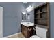 Full bathroom with a vanity, built-in cabinet, and a mirror at 4063 Lower Saxon Ave, North Las Vegas, NV 89085