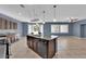Open kitchen with stainless steel appliances, granite countertops, and an island with seating at 4063 Lower Saxon Ave, North Las Vegas, NV 89085