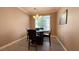 Lovely dining room with a modern light fixture and natural light at 4299 Fiore Bella Blvd, Las Vegas, NV 89135