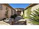 Inviting entryway showcasing a landscaped walkway leading to a double-door entrance with beautiful desert landscaping at 4299 Fiore Bella Blvd, Las Vegas, NV 89135