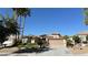 Charming single-story home featuring a well-maintained landscape, desert plants and a two car garage at 4299 Fiore Bella Blvd, Las Vegas, NV 89135