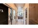 Hallway with access to the closet, laundry, and bathroom featuring modern fixtures at 4299 Fiore Bella Blvd, Las Vegas, NV 89135