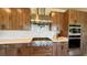 Gourmet kitchen with stainless steel appliances and custom cabinetry at 4299 Fiore Bella Blvd, Las Vegas, NV 89135