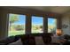 Inviting living room showcasing outdoor views from a comfortable seating area at 4299 Fiore Bella Blvd, Las Vegas, NV 89135