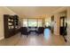 Bright living room showcasing an open floor plan and large windows with backyard views at 4299 Fiore Bella Blvd, Las Vegas, NV 89135