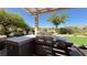 Enjoy outdoor cooking with this built-in stainless steel kitchen with a pergola at 4299 Fiore Bella Blvd, Las Vegas, NV 89135