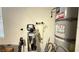 Utility room with water filtration system, water heater, and household cleaning supplies at 4299 Fiore Bella Blvd, Las Vegas, NV 89135