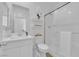 Clean bathroom with a glass enclosed shower, vanity with sink, and well-lit mirror at 4428 Mural Glen Ct, North Las Vegas, NV 89084