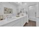 Bright bathroom featuring double sink vanity, framed art, and a separate shower and tub at 4428 Mural Glen Ct, North Las Vegas, NV 89084