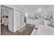 Modern bathroom showcasing a glass enclosed shower, tub, and walk-in closet at 4428 Mural Glen Ct, North Las Vegas, NV 89084