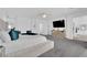 Bright bedroom featuring a king bed, ceiling fan, and carpet flooring at 4428 Mural Glen Ct, North Las Vegas, NV 89084