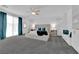 Bright bedroom featuring king bed, with curtains, ceiling fan, and carpet flooring at 4428 Mural Glen Ct, North Las Vegas, NV 89084
