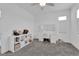 Cozy bedroom featuring ceiling fan, bookshelves, and ample room space at 4428 Mural Glen Ct, North Las Vegas, NV 89084