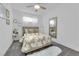 Cozy bedroom with plush carpet, a comfortable bed, and stylish decor at 4428 Mural Glen Ct, North Las Vegas, NV 89084