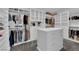 Spacious walk-in closet with custom shelving, drawers, and ample storage space at 4428 Mural Glen Ct, North Las Vegas, NV 89084