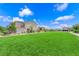 A large grassy common area in the community at 4428 Mural Glen Ct, North Las Vegas, NV 89084