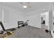 Bright exercise room with a treadmill, free weights, and ample space at 4428 Mural Glen Ct, North Las Vegas, NV 89084