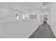 Hallway featuring carpet flooring, painting, and access to rooms at 4428 Mural Glen Ct, North Las Vegas, NV 89084