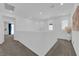 Upstairs hallway featuring carpet flooring, neutral paint, and natural light at 4428 Mural Glen Ct, North Las Vegas, NV 89084