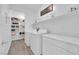 Well-organized laundry room with modern appliances and ample storage space at 4428 Mural Glen Ct, North Las Vegas, NV 89084