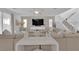 Bright living room with neutral tones, modern decor, and a large comfortable sofa at 4428 Mural Glen Ct, North Las Vegas, NV 89084