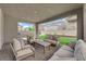 Covered patio with comfortable seating, providing a relaxing outdoor space at 4428 Mural Glen Ct, North Las Vegas, NV 89084