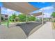 Community playground featuring shaded swings and recreational space for residents to enjoy outdoor activities at 4428 Mural Glen Ct, North Las Vegas, NV 89084