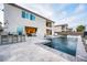 Backyard featuring a pool, hot tub, outdoor bar, and mountain views at 4576 Amazing View St, Las Vegas, NV 89129