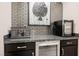 Elegant bar area with beverage cooler and stylish backsplash at 4576 Amazing View St, Las Vegas, NV 89129
