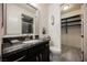 Modern bathroom features a granite vanity, a toilet, and a closet at 4576 Amazing View St, Las Vegas, NV 89129