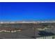 Stunning city view from the home's vantage point, with rooftops in the foreground and the city beyond at 4576 Amazing View St, Las Vegas, NV 89129