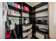 A tidy walk-in closet showcases dark shelving, storage baskets, and ample room for organizing at 4576 Amazing View St, Las Vegas, NV 89129