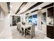 Elegant dining room with seating for eight, designer lighting, and wine storage, perfect for entertaining at 4576 Amazing View St, Las Vegas, NV 89129
