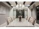 Dining room with large dining table, wine rack, and modern lighting at 4576 Amazing View St, Las Vegas, NV 89129