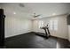 Home gym with a treadmill, rubber flooring, plantation shutters, recessed lighting, and a ceiling fan at 4576 Amazing View St, Las Vegas, NV 89129