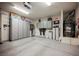 Well-lit garage featuring epoxy flooring and plenty of storage at 4576 Amazing View St, Las Vegas, NV 89129