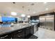 Open kitchen features granite countertops, stainless steel appliances, and pendant lighting, with an adjacent living area at 4576 Amazing View St, Las Vegas, NV 89129