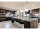 Stunning kitchen with a large granite island, stainless steel appliances and sleek, modern cabinetry at 4576 Amazing View St, Las Vegas, NV 89129