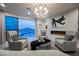 Living room with mountain views, modern fireplace and plush seating at 4576 Amazing View St, Las Vegas, NV 89129