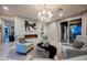 Living room with modern fireplace, plush seating, and patio view at 4576 Amazing View St, Las Vegas, NV 89129