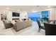Bright living area with large windows, fireplace, and elegant furnishings offering seamless indoor-outdoor living at 4576 Amazing View St, Las Vegas, NV 89129