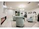 Living room featuring modern fireplace, plush seating, and view to bar at 4576 Amazing View St, Las Vegas, NV 89129