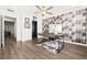 Office space with hard wood floors, a modern desk with a cow hide rug and an accent wall at 4576 Amazing View St, Las Vegas, NV 89129