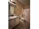 Functional bathroom with single vanity, tiled floors, and shower-tub combo, designed for everyday use at 5161 Briar Meadow Way, Las Vegas, NV 89118