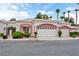 Charming home featuring a two-car garage, lush landscaping, and a welcoming entrance, perfect for suburban living at 5161 Briar Meadow Way, Las Vegas, NV 89118